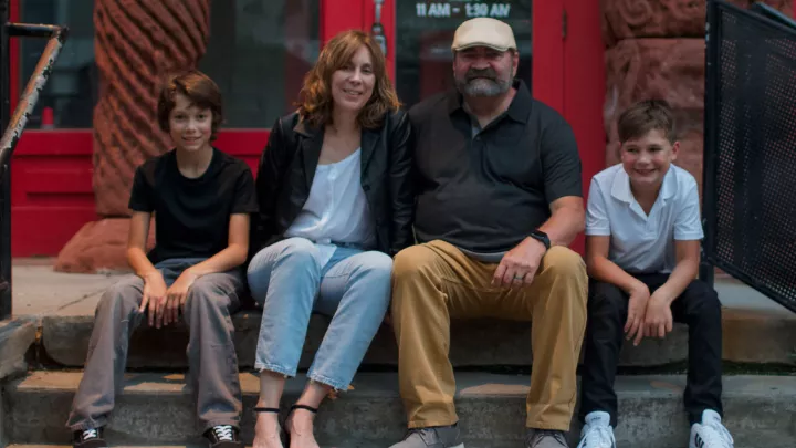 Patient Jake White with his wife and two sons