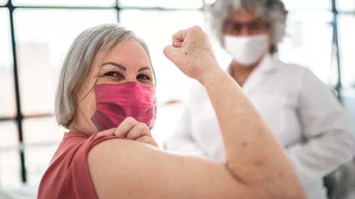 picture of a woman getting ready for her vaccination