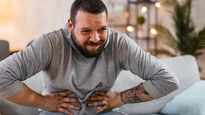 Man holding his stomach