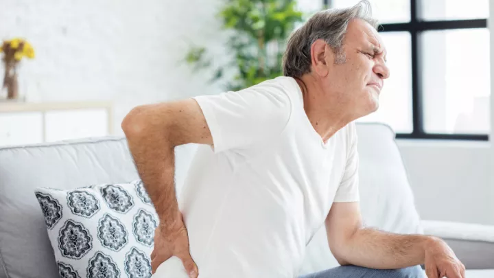 Man holding his back in pain