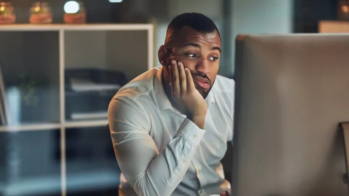 Man staring at a computer