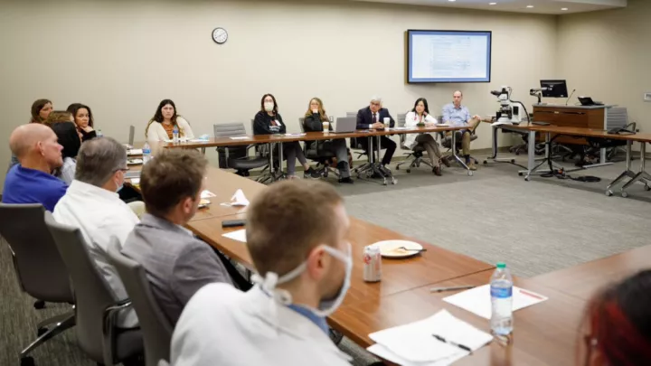 Nebraska Medicine colleagues meeting in a conference room