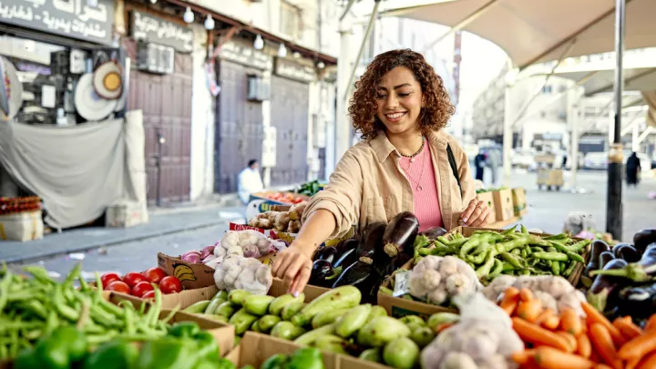 Woman selecting produce at the farmer's market