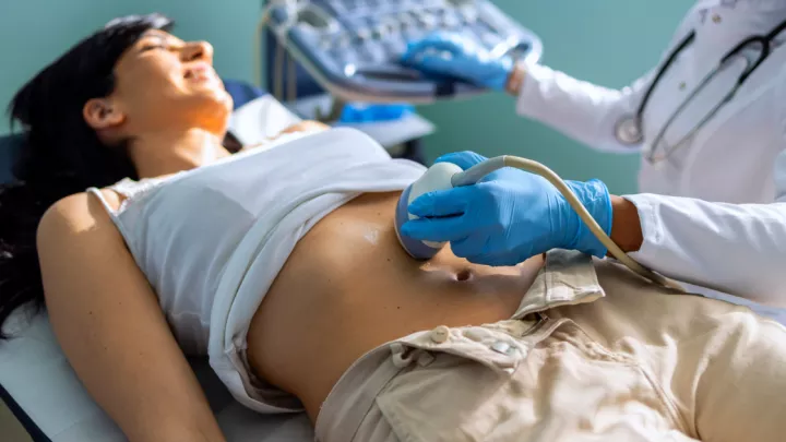 Woman receiving an ultrasound on her stomach