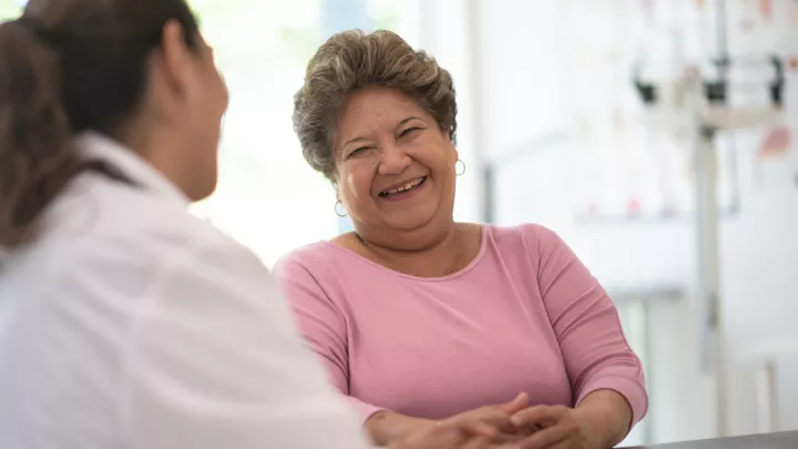 Middle-aged woman speaking to her doctor
