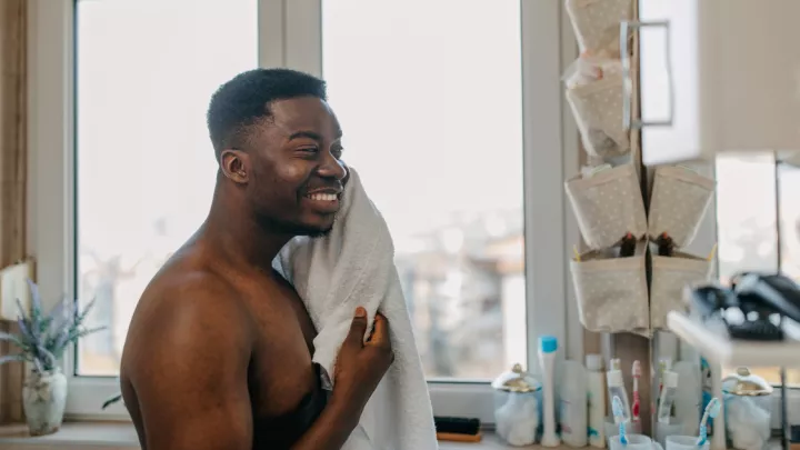 Man washing his face