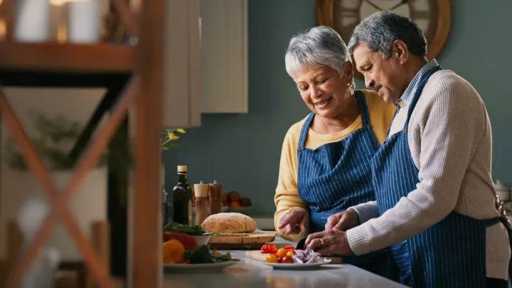 Husband and wife cooking in the kitchen