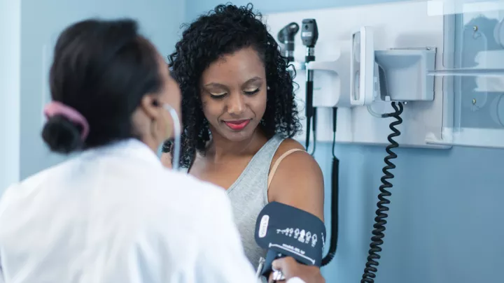 Woman getting her blood pressure taken