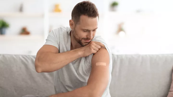 Man looking at his shoulder