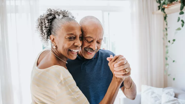 Older woman dancing with an older man