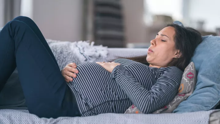 Pregnant woman on couch