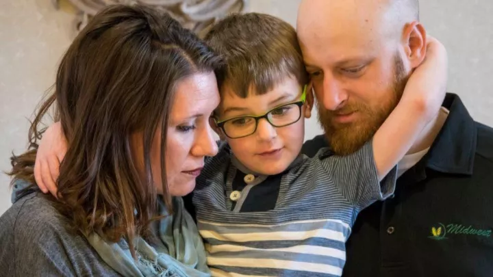 Mother, father, and young son