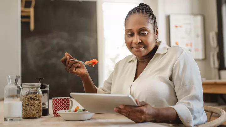 picture of a woman eating a meal