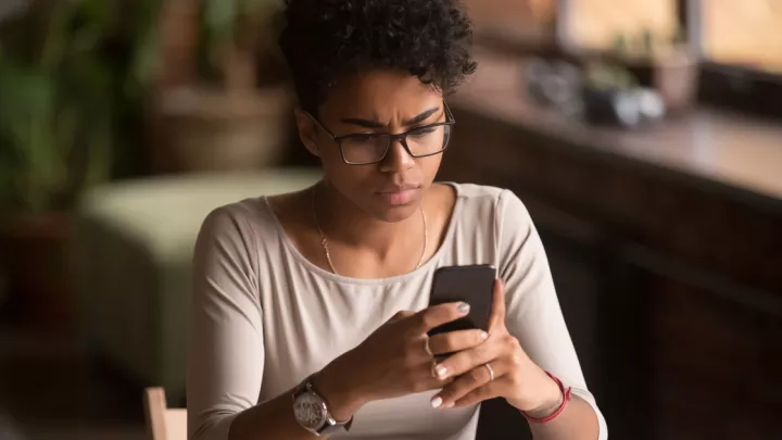 Young woman looking at her phone