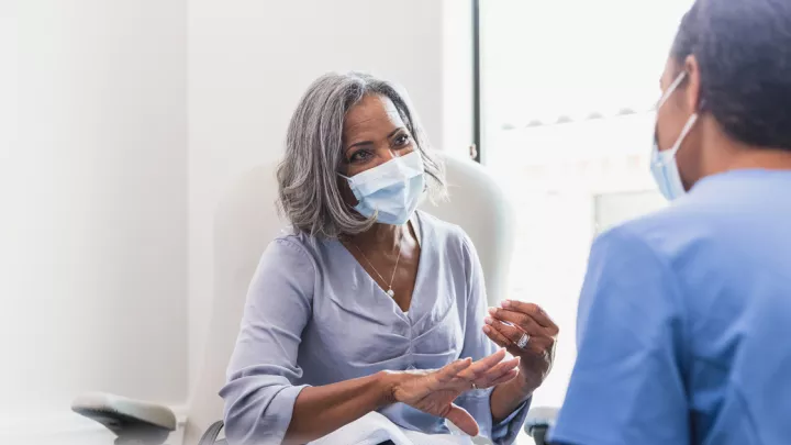 Older woman talking to her doctor